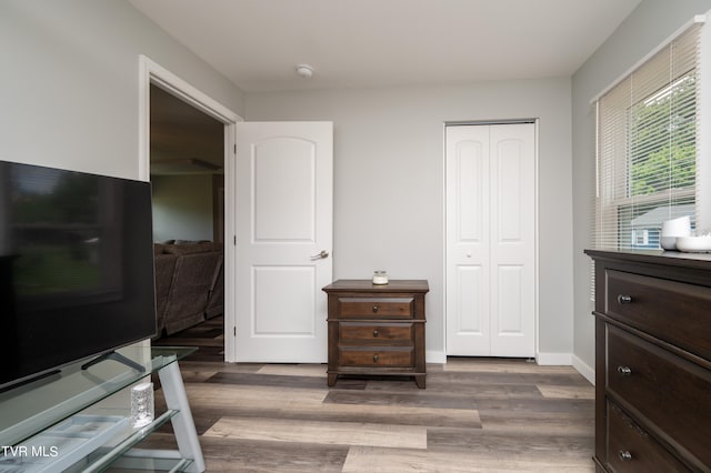 bedroom featuring a closet and hardwood / wood-style flooring