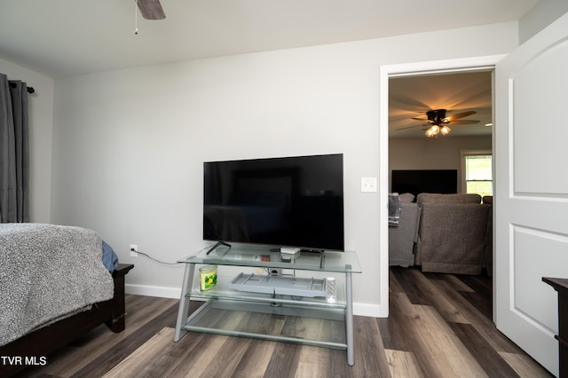 bedroom with dark wood-type flooring