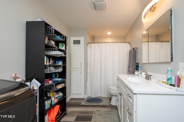 bathroom with vanity, toilet, hardwood / wood-style floors, and a shower with shower curtain