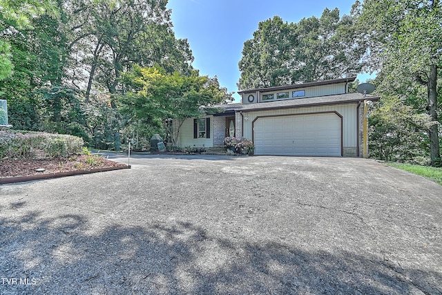 view of front of property with driveway and a garage