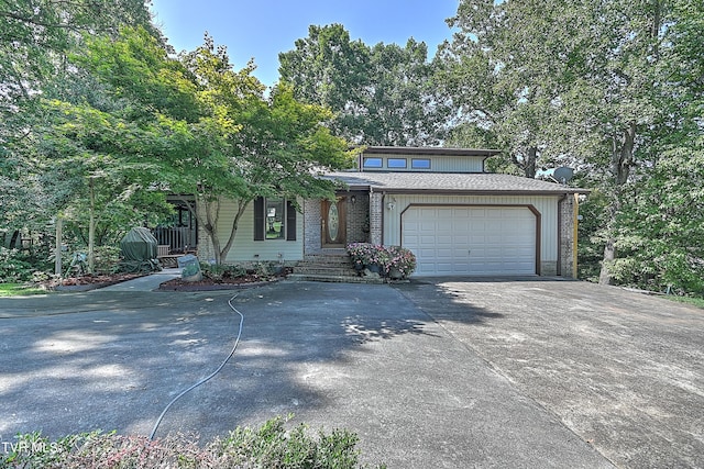 view of front of home featuring an attached garage and concrete driveway