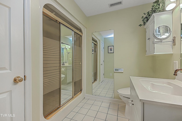 full bath featuring tile patterned floors, visible vents, a shower stall, and toilet