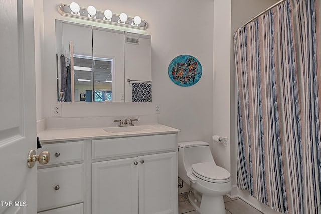 bathroom featuring vanity, curtained shower, toilet, and visible vents