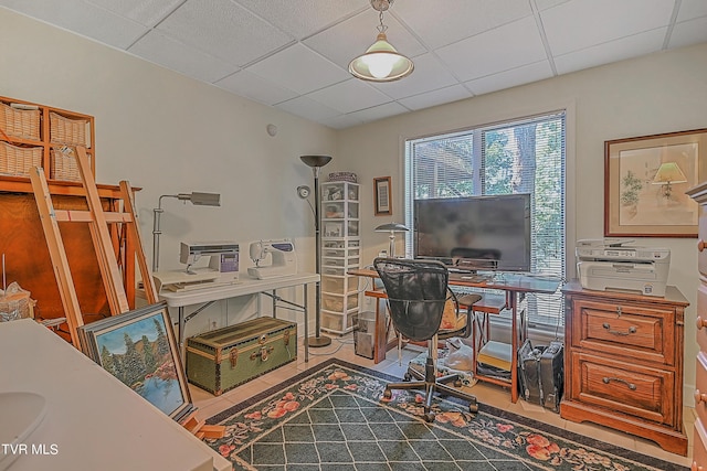 office with tile patterned floors and a drop ceiling