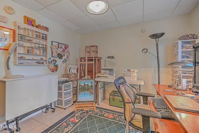 home office with tile patterned flooring and a drop ceiling