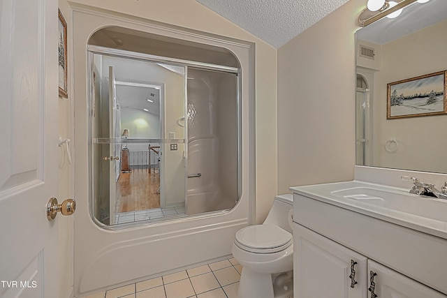 full bath with tile patterned flooring, visible vents, toilet, vanity, and a textured ceiling