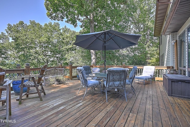 wooden terrace featuring outdoor dining area