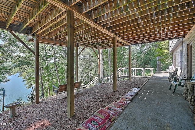 view of patio with a water view