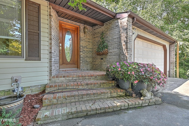 entrance to property with a garage and driveway