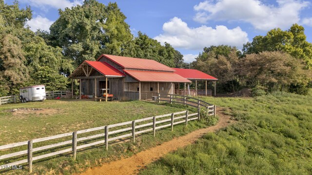 exterior space with a rural view and an outdoor structure