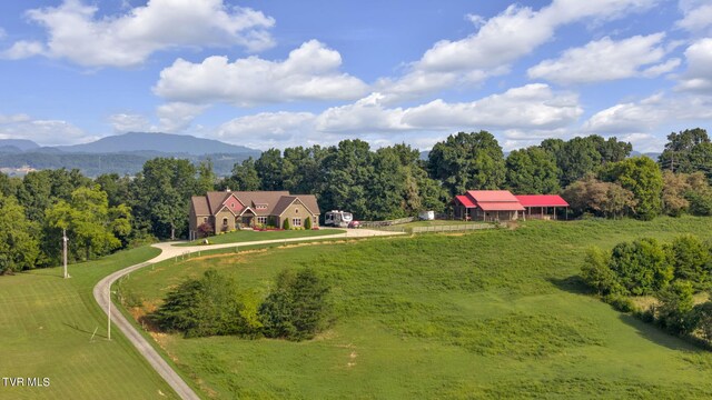 birds eye view of property featuring a mountain view and a rural view