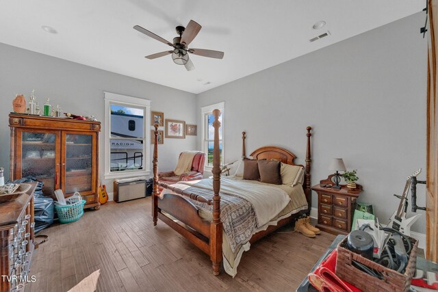 bedroom featuring ceiling fan and light hardwood / wood-style floors