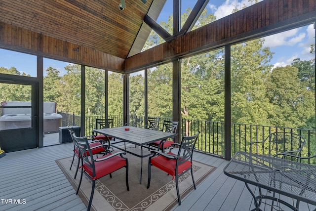 sunroom with a wealth of natural light, wood ceiling, and vaulted ceiling