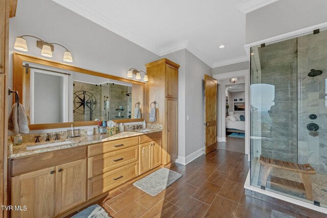 bathroom featuring ornamental molding, vanity, and walk in shower