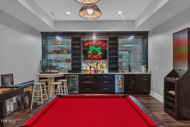 bar featuring dark wood-type flooring, pool table, and wine cooler