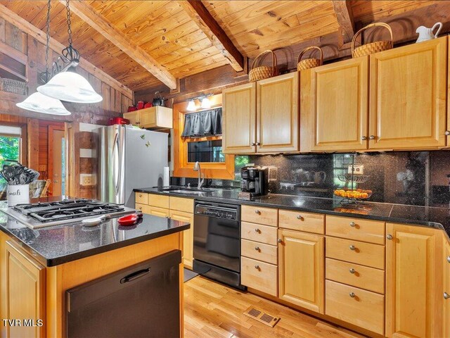 kitchen featuring light wood-type flooring, wooden walls, stainless steel appliances, wood ceiling, and beam ceiling