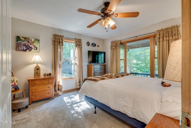 bedroom featuring ceiling fan and carpet floors