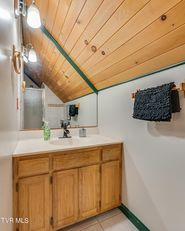 bathroom featuring tile patterned floors, vanity, wood ceiling, and vaulted ceiling