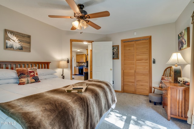 bedroom with carpet, ceiling fan, and a closet