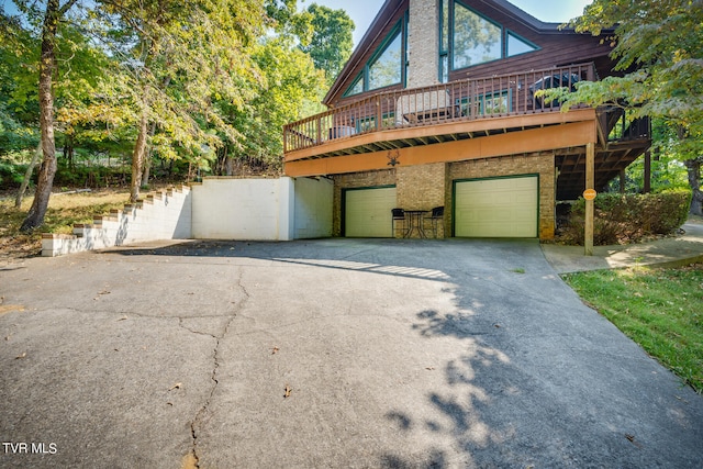 view of front of house featuring a wooden deck and a garage