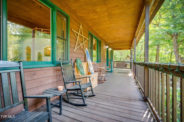 wooden terrace featuring a porch