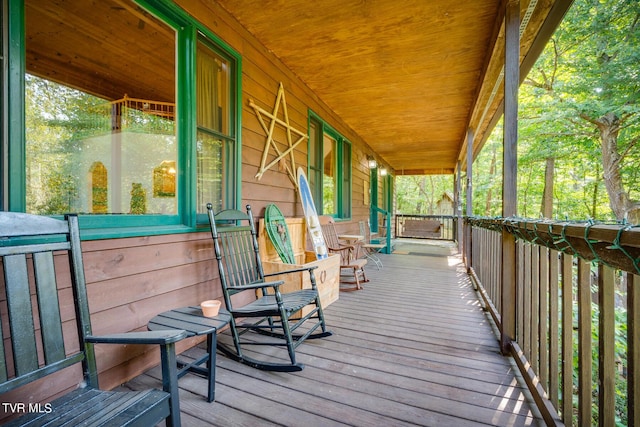 wooden deck featuring covered porch