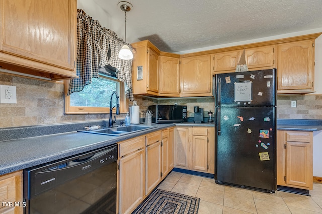 kitchen featuring backsplash, sink, black appliances, light tile patterned floors, and pendant lighting