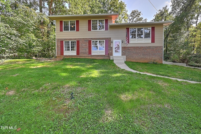 split level home with a front lawn