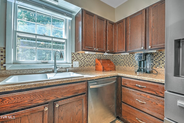 kitchen with dishwasher, sink, and decorative backsplash