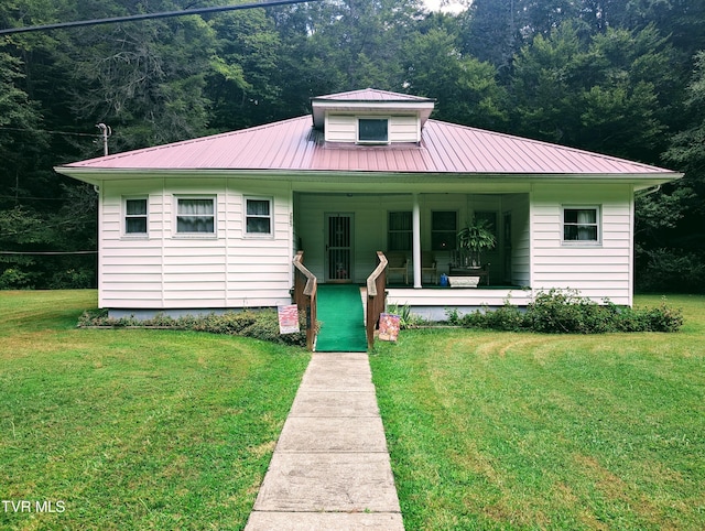 bungalow featuring a front lawn and a porch