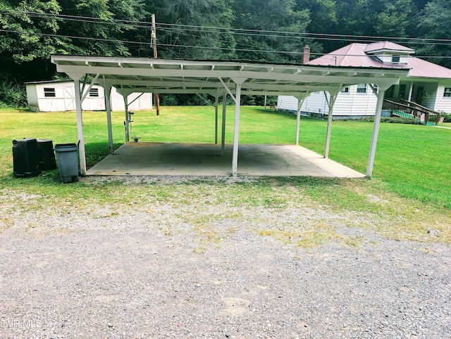 view of car parking with a lawn and a carport