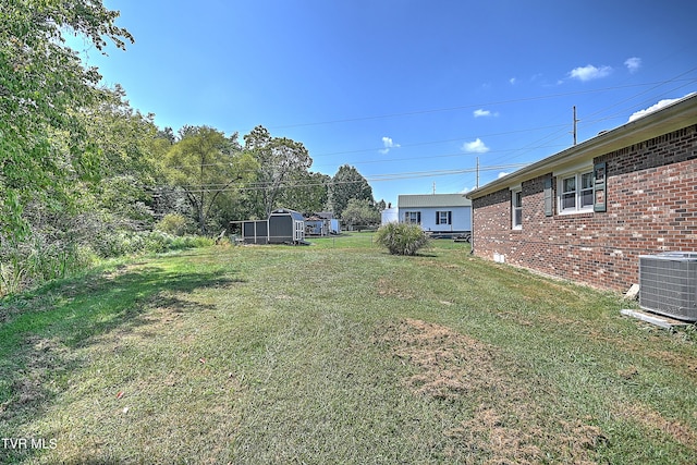 view of yard featuring central AC unit