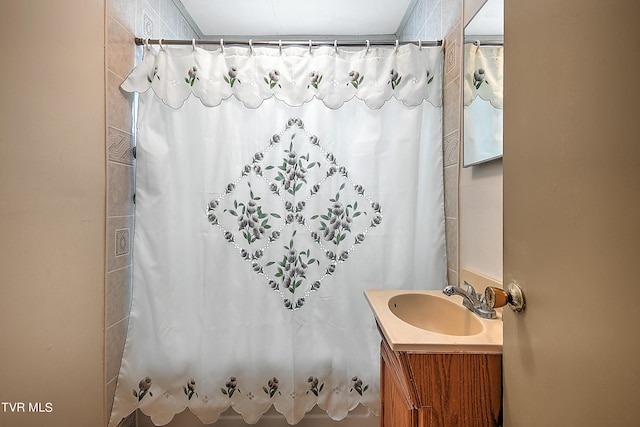 bathroom featuring vanity and a shower with shower curtain