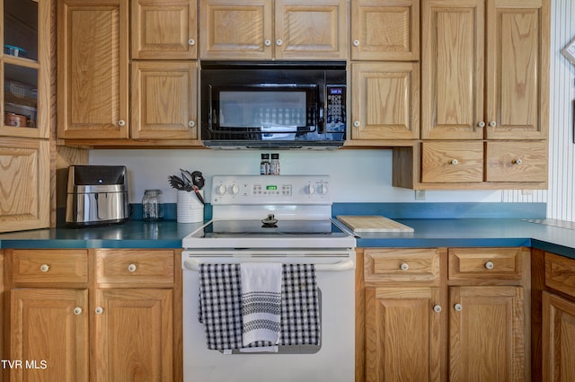 kitchen featuring white electric stove