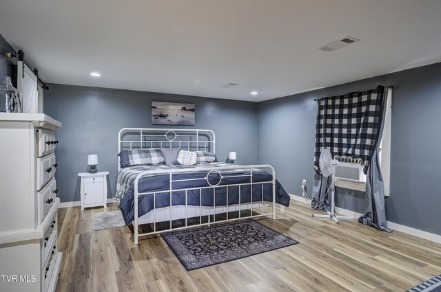 bedroom with light wood-type flooring