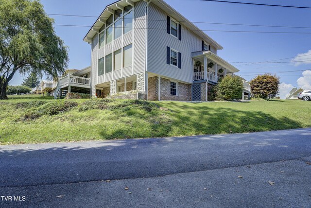 view of home's exterior with a lawn