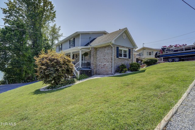 view of front of home with a front lawn and covered porch