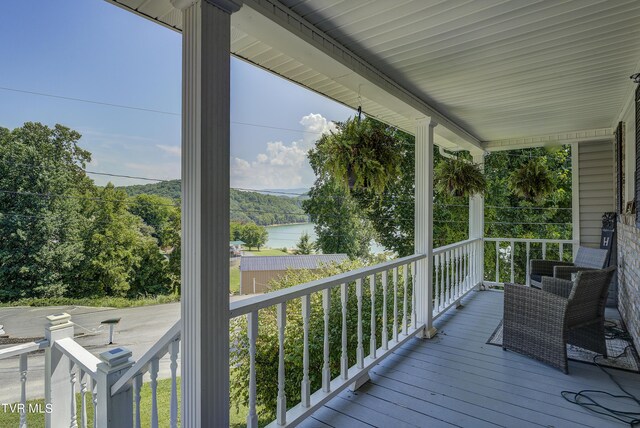 wooden deck with a water view