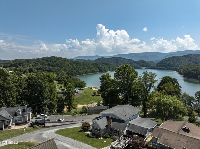 aerial view featuring a water and mountain view