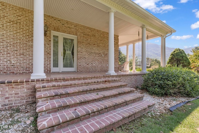 exterior space with a mountain view and a porch