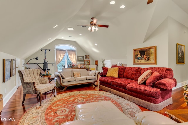 living room with lofted ceiling, wood-type flooring, and ceiling fan