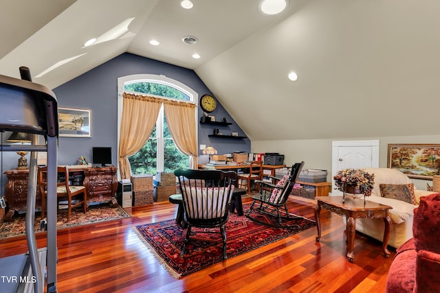 dining room featuring vaulted ceiling and hardwood / wood-style floors