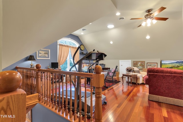 interior space featuring lofted ceiling, ceiling fan, and wood-type flooring