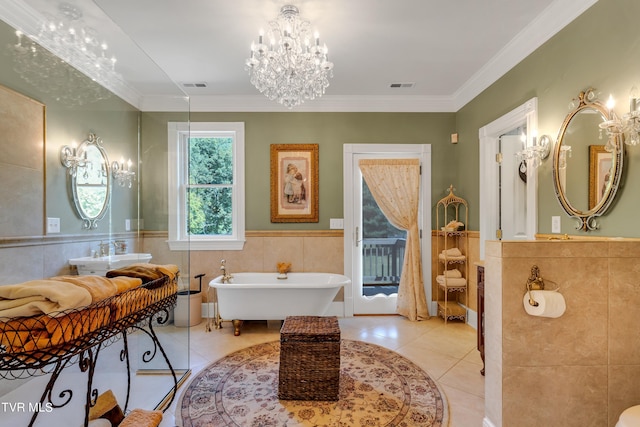 bathroom featuring crown molding, tile patterned floors, a chandelier, tile walls, and a washtub