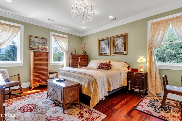 bedroom with crown molding, dark wood-type flooring, and a notable chandelier