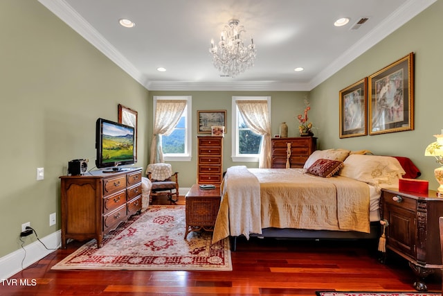 bedroom featuring crown molding, dark wood-type flooring, and a notable chandelier