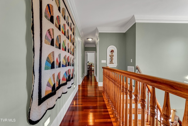 hallway featuring dark hardwood / wood-style floors and crown molding