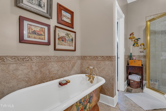 bathroom featuring tile patterned flooring, tile walls, and plus walk in shower