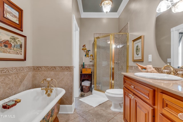 full bathroom featuring ornamental molding, vanity, toilet, and separate shower and tub