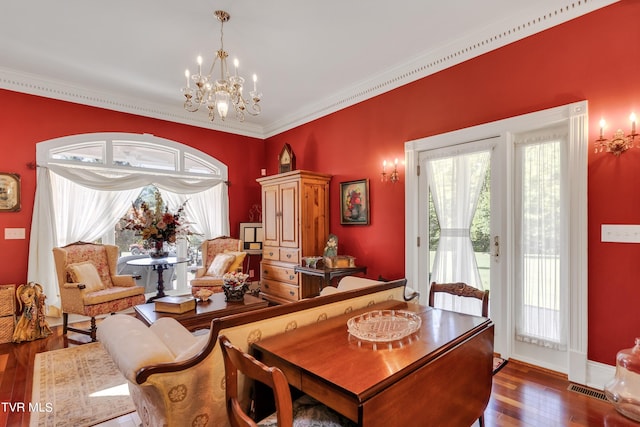 interior space featuring a chandelier, dark hardwood / wood-style flooring, and crown molding